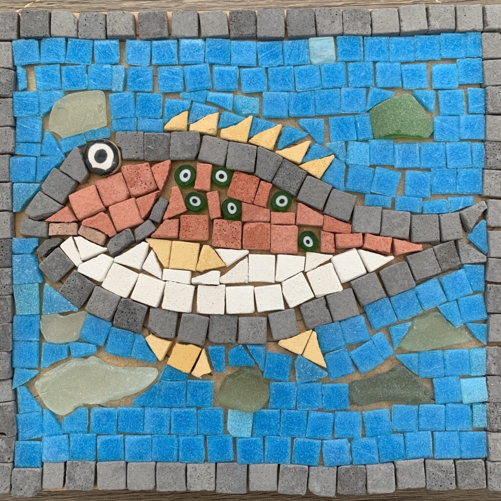 Completed fish mosaic with seaglass background